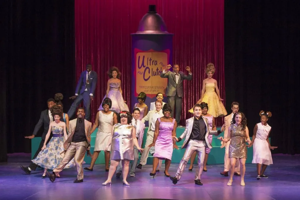 Historic BAMA Theatre marquee illuminated at night featuring Arts Council concert