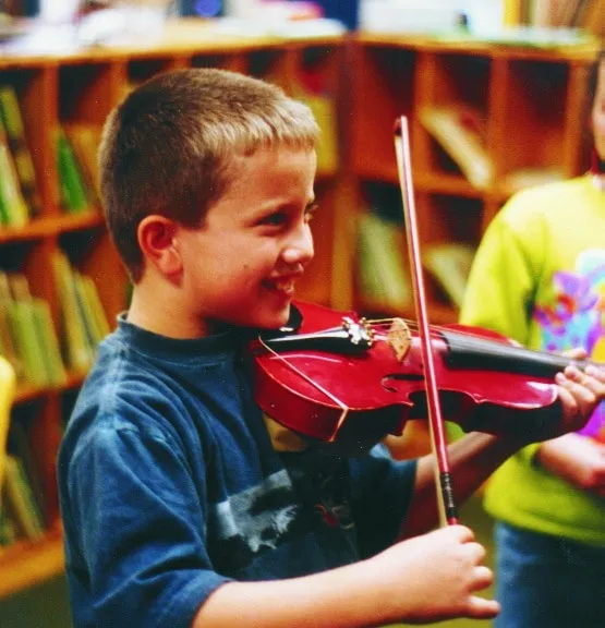 Artist creating detailed artwork in hands-on workshop environment