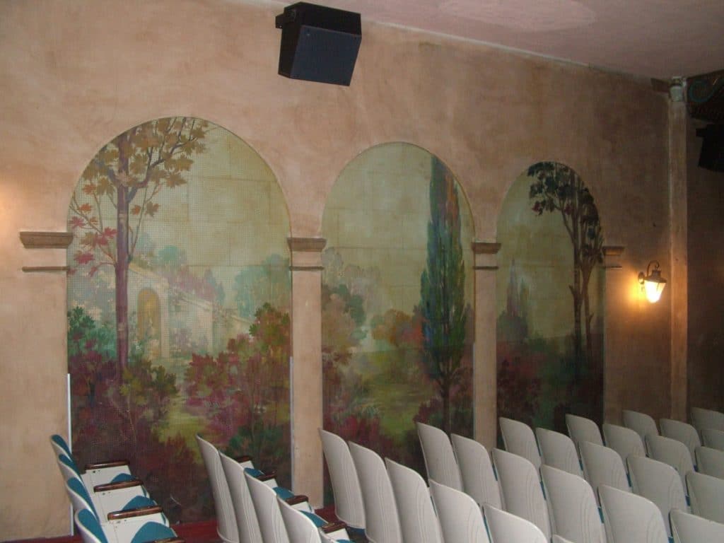Restored murals on the walls inside the Bama theatre. 