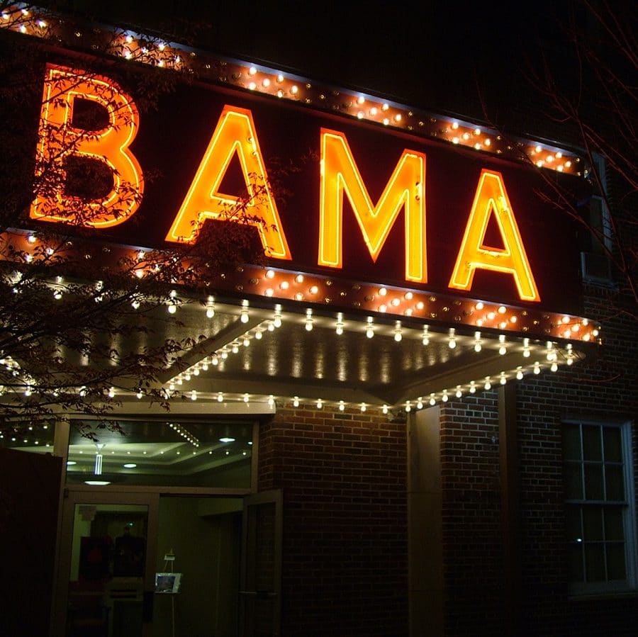 Bama Theatre Marquee lit up at night.